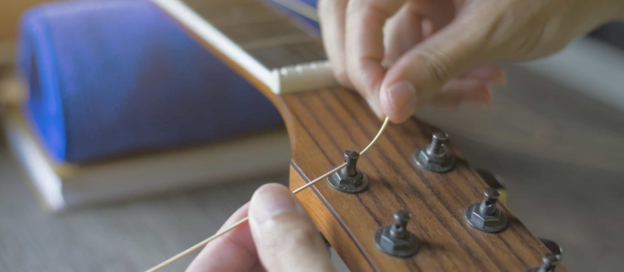 restringing classical guitar